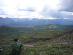 Enjoying the extra warmth of the jacket while taking a break in Alaska