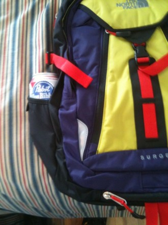Hi Shroutk, A full size 32oz nalgene will not fit in the side pockets. However I am sure it will fit smaller water bottles and as you can see it fits a PBR just fine.
