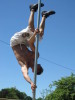 acro on spinning pole in parade