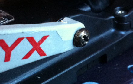 OK Here is my fix. I used #10 X 3/4 Round head screws with the point filed down to match the stock post threads. I used bicycle cable ends for the bushings, drilled out and ground down to the correct length. The hole in the Heel lift is drilled out to 15/64" to match the bushing. Be sure to leave the bushing long enough so the screw head clears the heel lift as it is rotated during the lift, since it expands outward during this move. <br/> I am including a photo of the finished job and detail photos in the next two postings (can't do 3 photos in one posting).