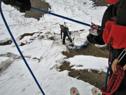An ATC XP being used to belay a skier over crevassed terrain in the Wrangell St. Elias Mountains.