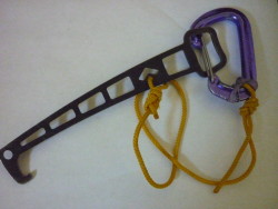 My setup - a small piece of cord is retained with an "Xed" rubber band