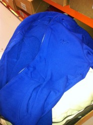 The liner is a solid blue zip up hoody with pockets