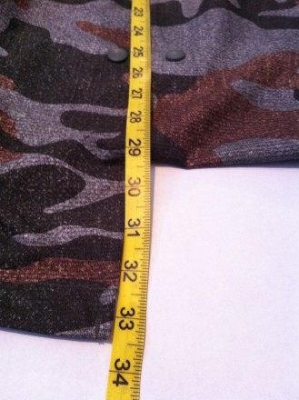 On a medium it's about 33.5" to the bottom of the coattails. If you choose to button up the tails it's about 29.5".