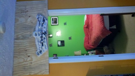 I extended the 3/4" backboard about 8-10 inches below the top of my doorframe. So now the hangboard sits just above head level and I can do full extension pull ups well above the board with no issues whatsoever. .  Tall people may have an issue with this suggestion. I'm about 5'11" and I'm maybe 2-3 inches from hitting my head on the hangboard when walking through the doorway. <br/>  <br/> I used 2 extra sections I cut off the 3/4" backboard I had to act as a buffer so the board doesn't sit right on the doorframe. The backboard ended up being 21"x48" before I set it into the studs so I could screw some extra holds in later. <br/>  <br/> OH! AND I can still close the door just fine!
