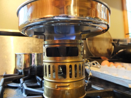 No, it cannot be used as a fry pan as the metal is way too thin.  I tried and it immediately oil-canned from the heat even though my stove was set to simmer.  Makes a great lid and plate though.  If you want a lid to fry in, try the Primus stainless steel pot set.  It has a much thicker bottom with a layer of aluminum sandwiched inside.  Of course that makes it a little heavier to carry.  The pics are the Primus fry pan.