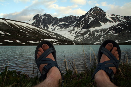Several: Chacos run large for there size, so consider going down another half size.  If you exchange them for the z/1, you can wear socks underneath while your feet break in.  It's possible that your feet just don't fit chacos well; maybe the wides will work better for you; maybe you need to try other brands.  Chacos don't really break in like soft-soled sandals, and 9 miles is a pretty good ways to walk in sandals that your feet aren't familiar with.
