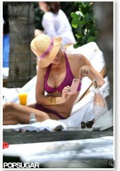 Brooke Burke wears the Bella Twist Top in the New Berry color for 2013