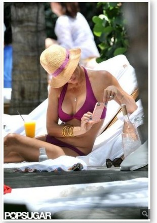 Brooke Burke wears the Bella Twist Top in the New Berry color for 2013