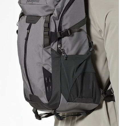 Matt, <br/> The pack vest could definitely carry a rod tube, looks like there are a couple options.  Quick and easy would be in the water bottle pocket secured with one strap, or the straps on the bottom depending on how long of a tube, or there are options for adding your own straps...