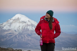 keeping warm on Volcan Parinacota, Bolivia at sunset 17k